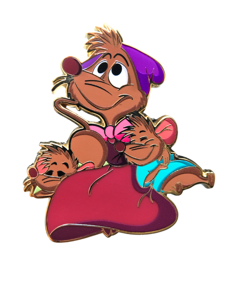 Mary Mouse from cinderella with two baby mice cuddled up on either side of her. 
