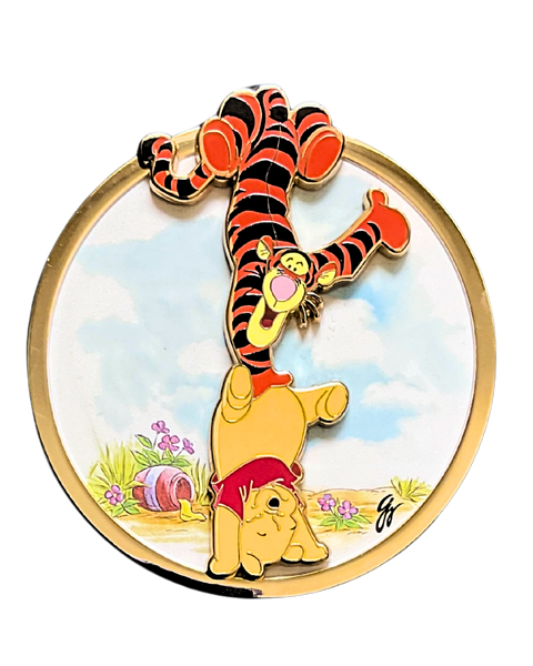 Disney character pin featuring Tigger and Winnie the Pooh with a gold border