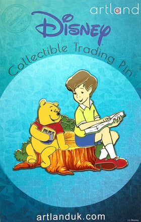 winnie the pooh is sat with christopher robin on a tree stump. christopher is pointing at a page in a book and winnie is holding a pot of honey. they are smiling at eachother.